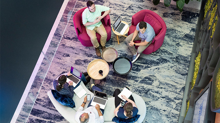 Five employees working