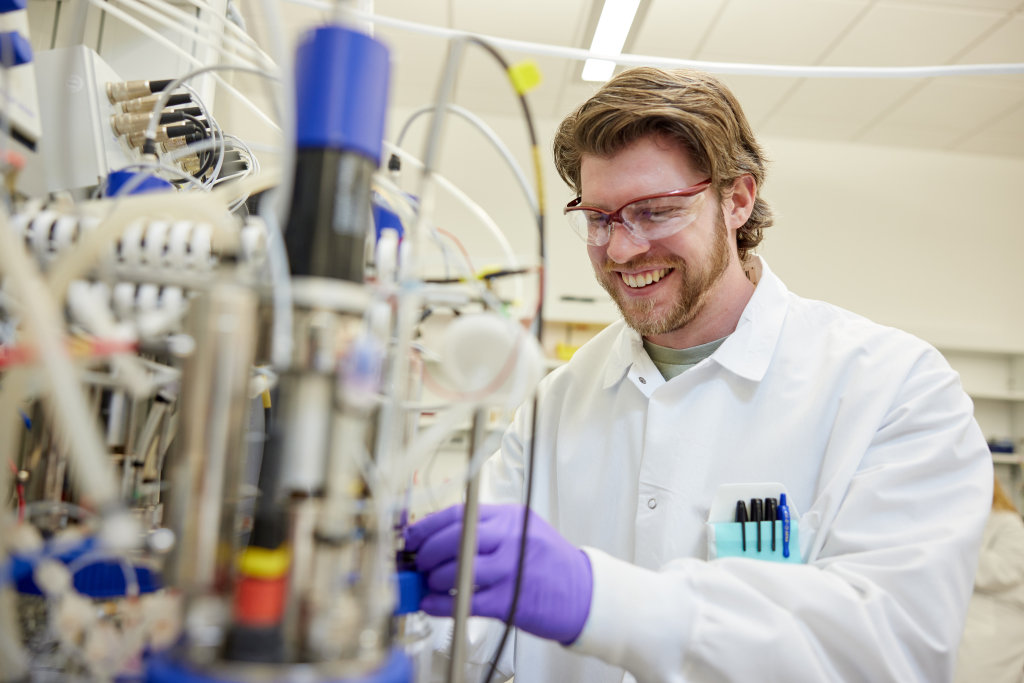 An employee from Invaio talking to another employee